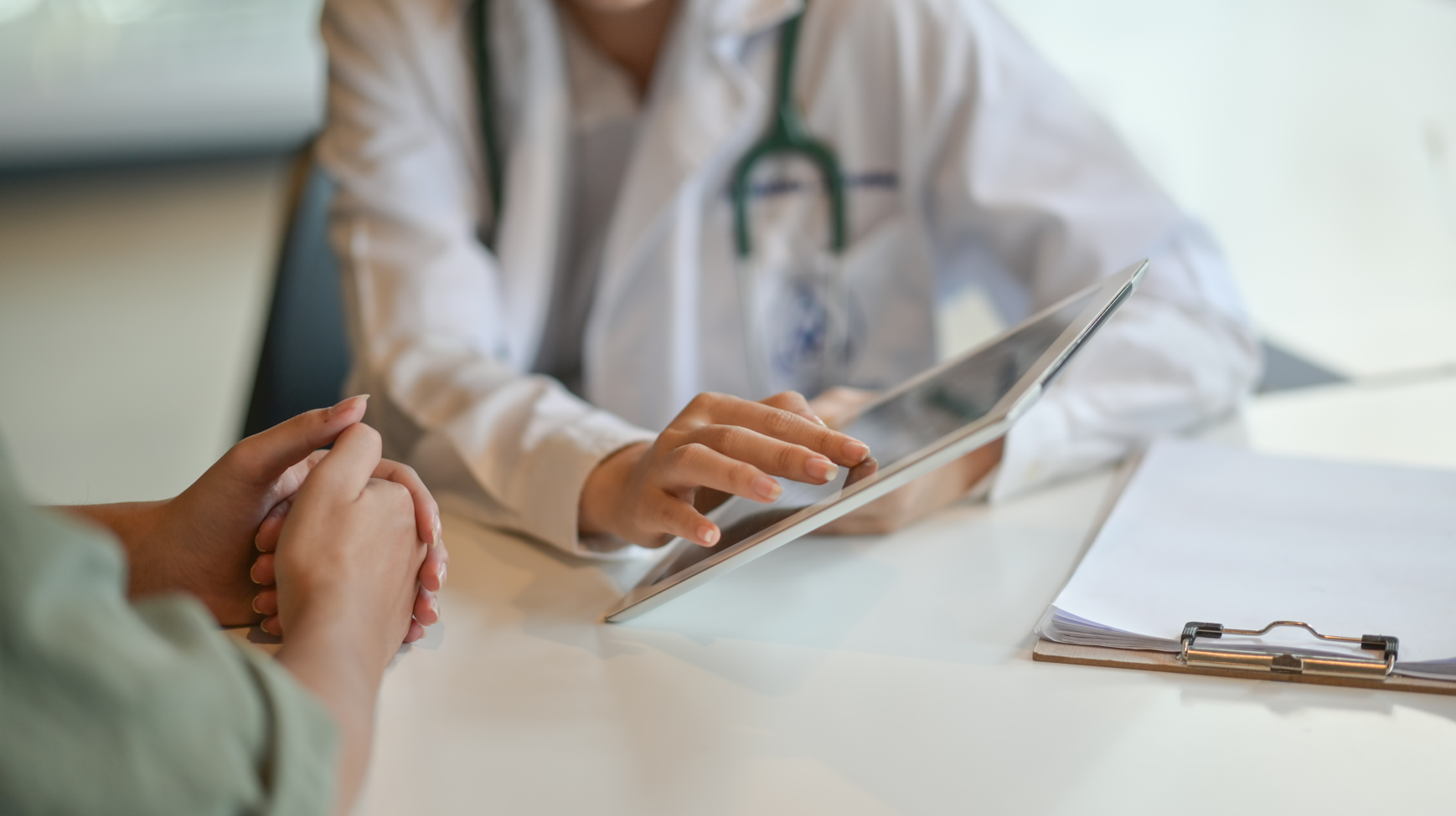 Doctor showing patient something on tablet